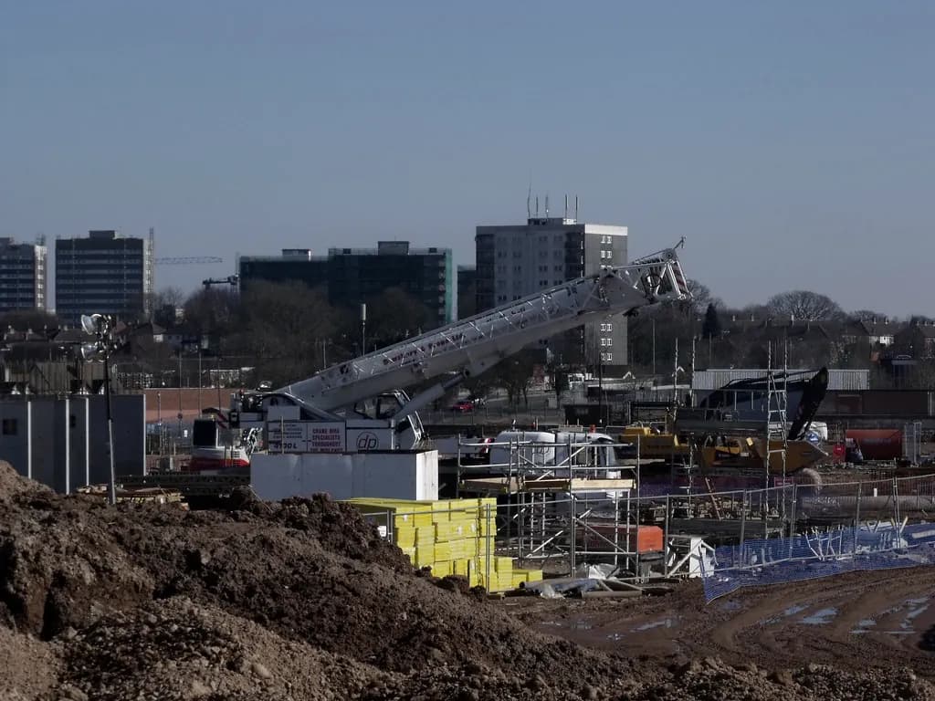 Mobile crane lifting on a steel structure