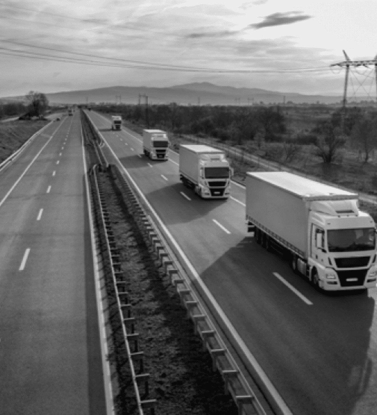 Aerial view of trucks in convoy on the highway